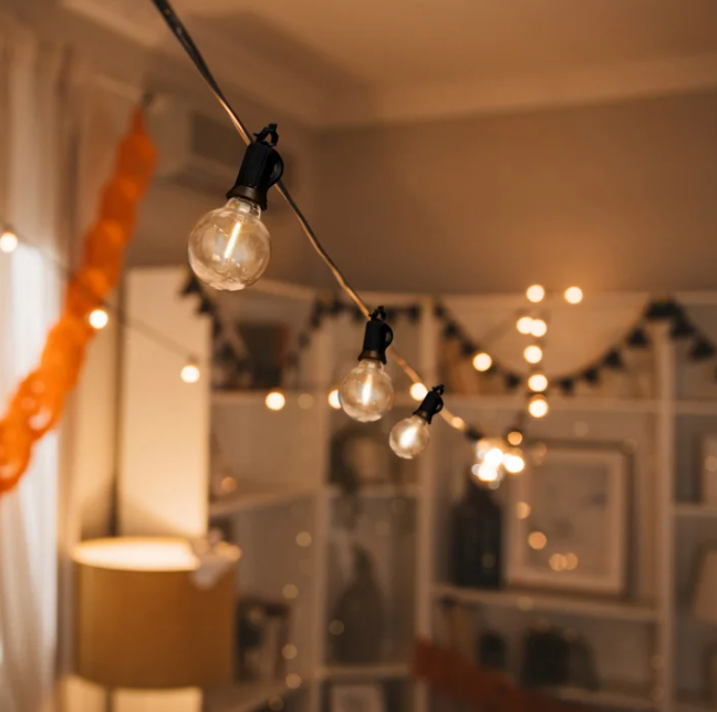 String of light bulbs hanging in a room